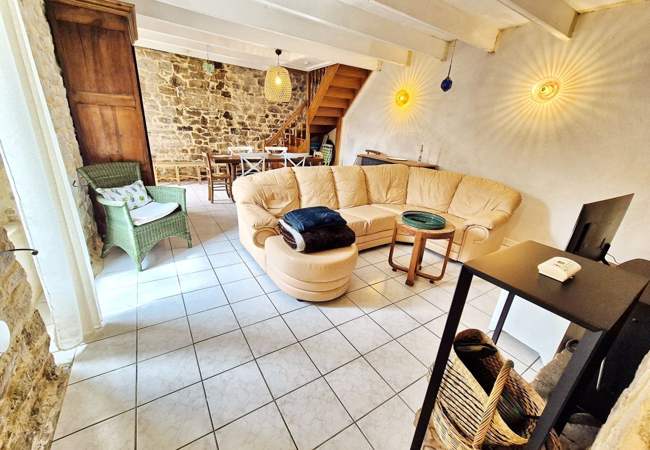 Living room with TV and wood-burning stove