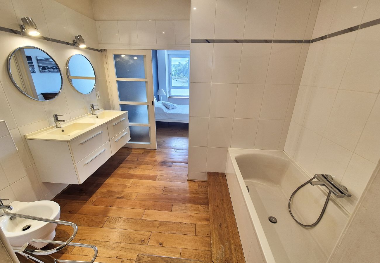 Bathroom with shower and bath